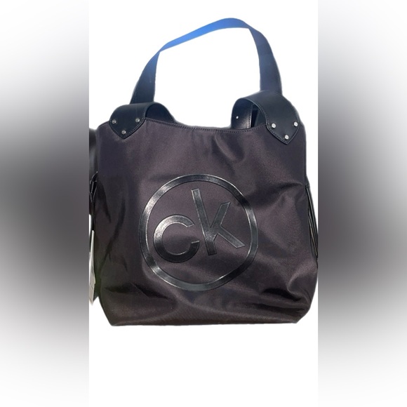 CK drawstring bucket bag. Plastic still on the hardware. And smells great. - Picture 6 of 6